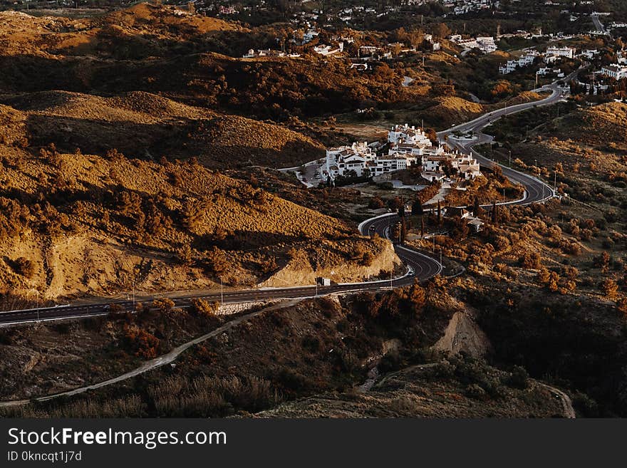 Bird&#x27;s Eye View Photograph of Curvy Asphalt Road