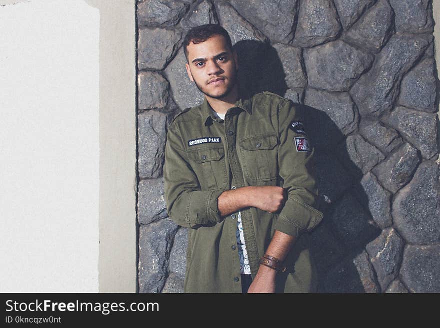 Man Wearing Green Button-up Jacket