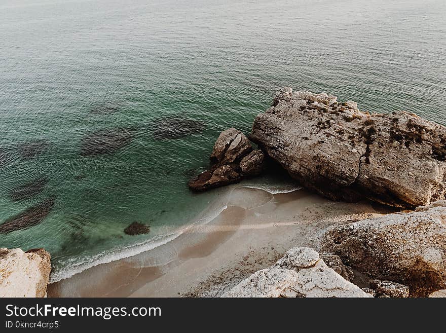 Rock Formation Near Body of Water