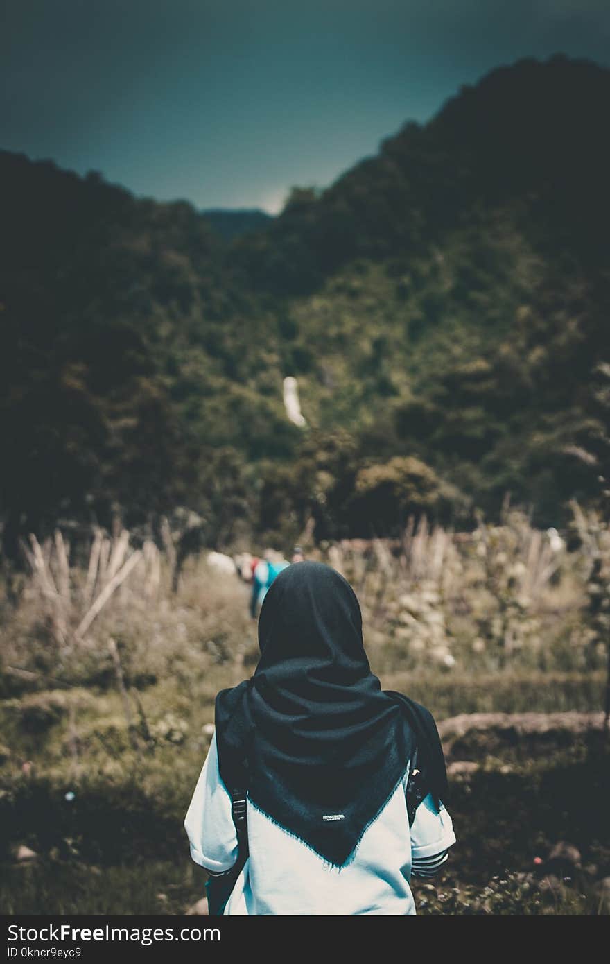 Shallow Focus Photography of Person in White Top and Headdress