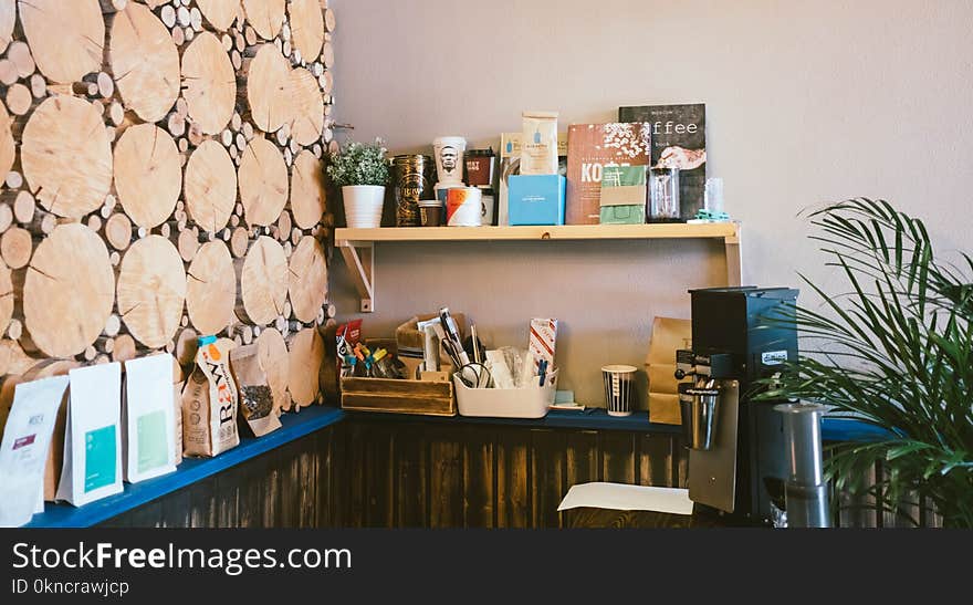 Photo of Books on Brown Wooden Wall Shelf in Room