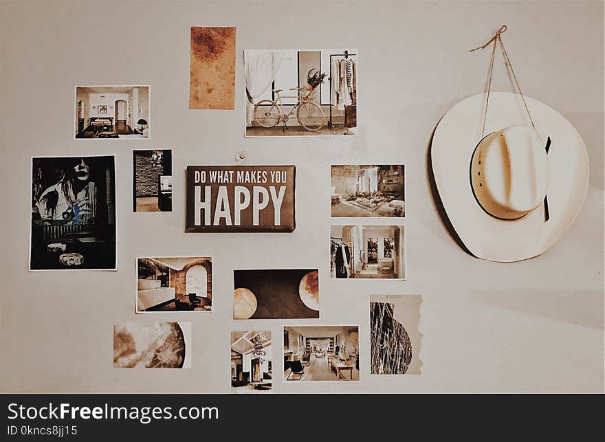 Photo of Brown and White Photo Frames Hang in Wall