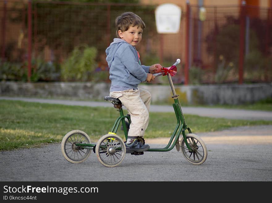 Boy Riding Green bike