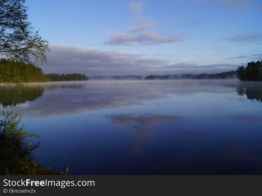 Landscape Photo of Body of Water Surrounded by Trees