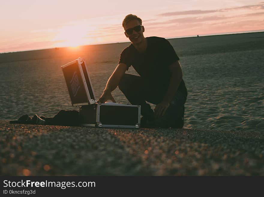 Man Near Black Flight Case