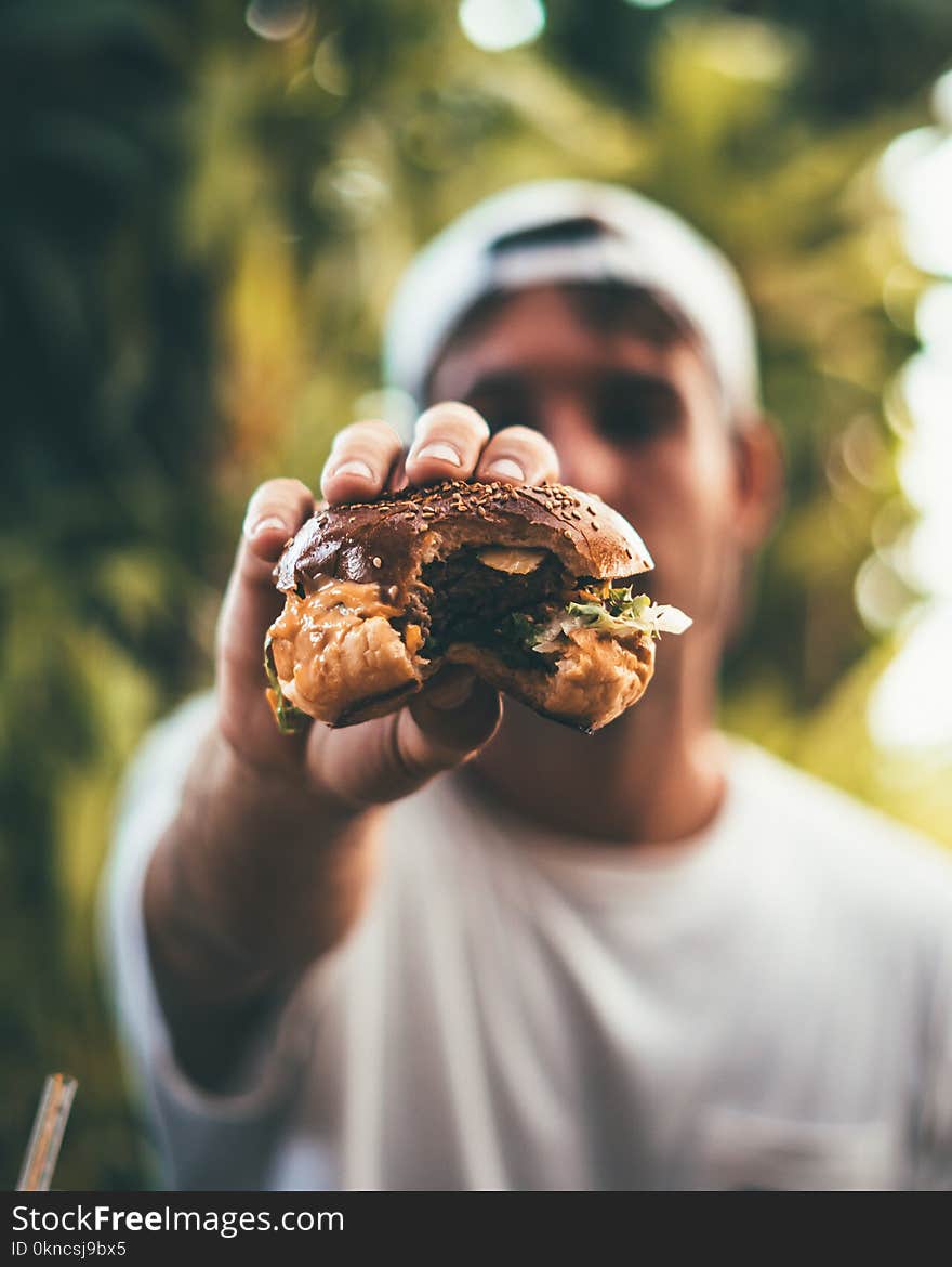 Photo of Person Holding Burger