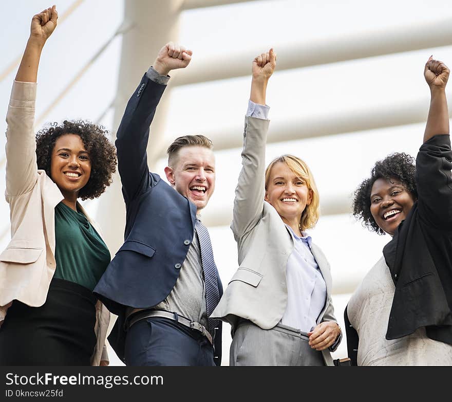 Group of People Raising Right Hand