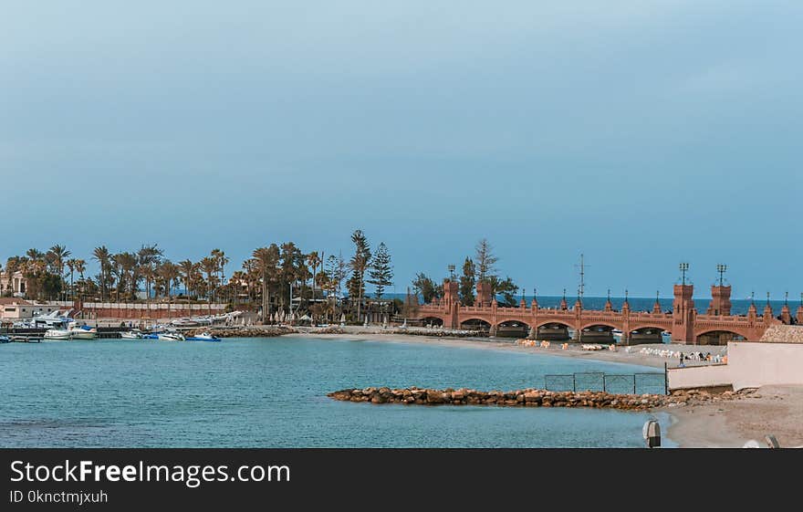 Orange Concrete Bridge Surrounded by Water