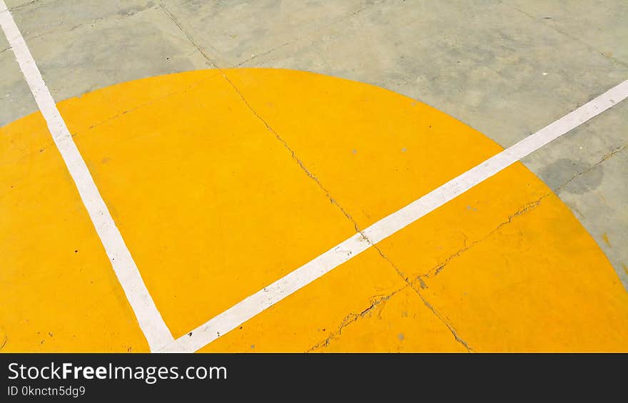 Gray Concrete Pavement With Yellow and White Paint