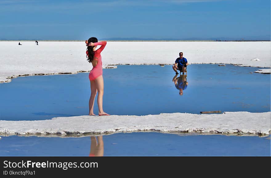 Woman in Pink Long-sleeved Swimsuit on Island