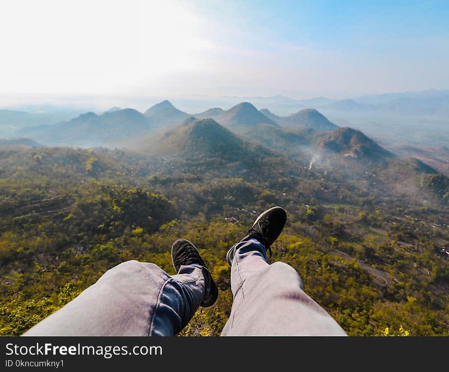 Closeup Photo of Person&#x27;s Foot Near Mountain