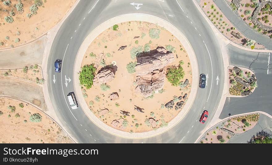 Aerial Photo of Four Cars on round about at Daytime