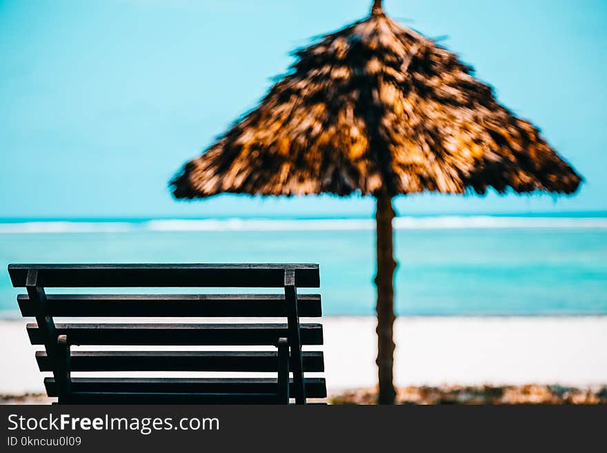 Beach Lounge Chair With Straw Parasol