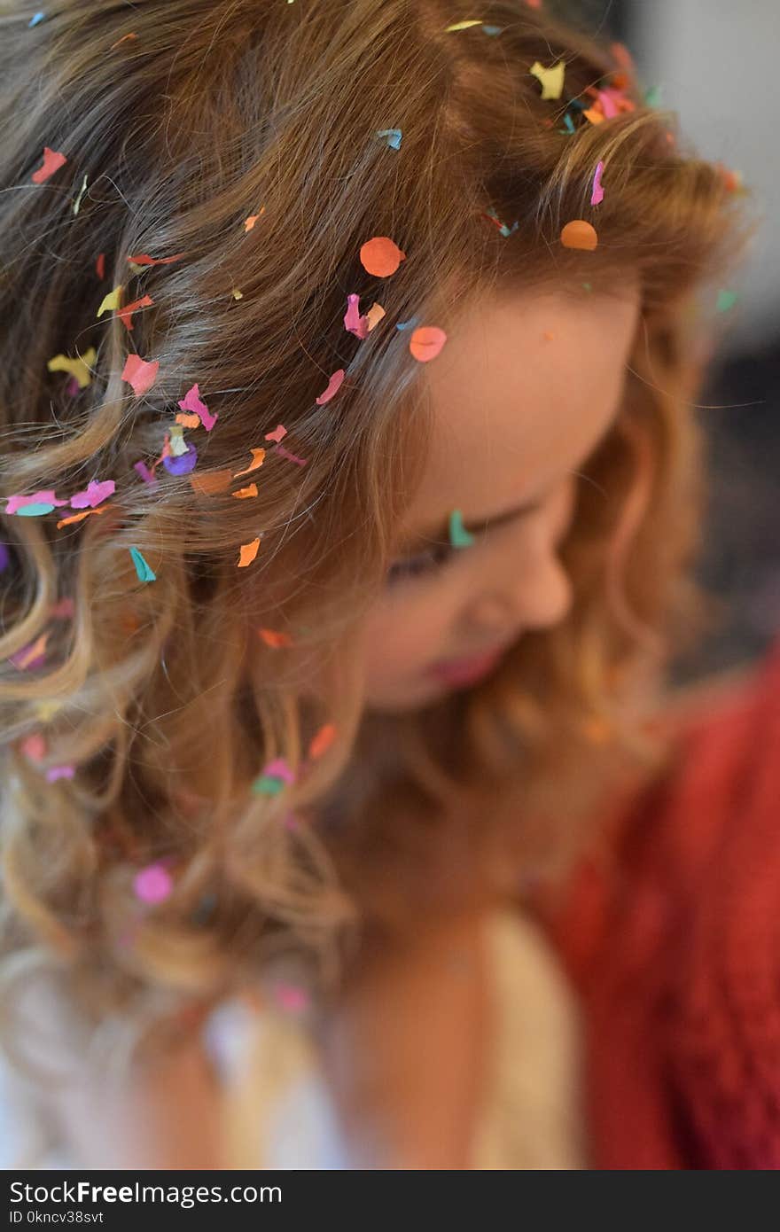 Shallow Focus Photography of Brown Haired Woman With Confetti on Hair