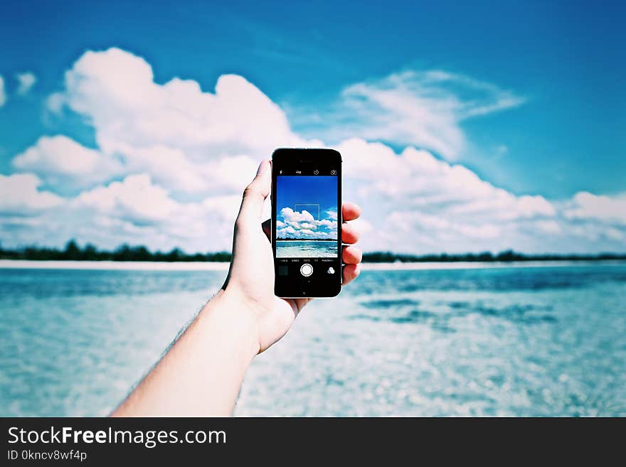 Person Holding Black Iphone