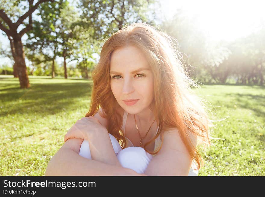 Portrait of beautiful woman in reeds field