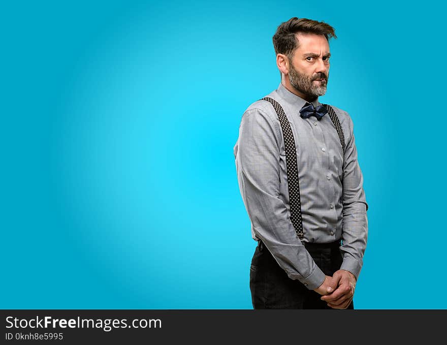 Middle age man, with beard and bow tie doubt expression, confuse and wonder concept, uncertain future. Middle age man, with beard and bow tie doubt expression, confuse and wonder concept, uncertain future
