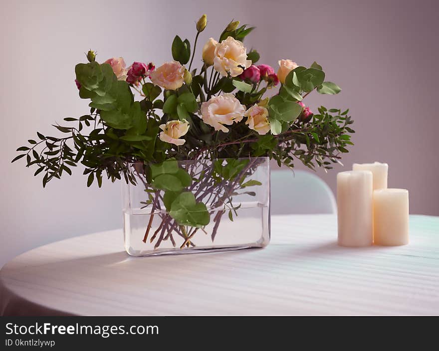 Flower arrangement on a white table. Flower arrangement on a white table