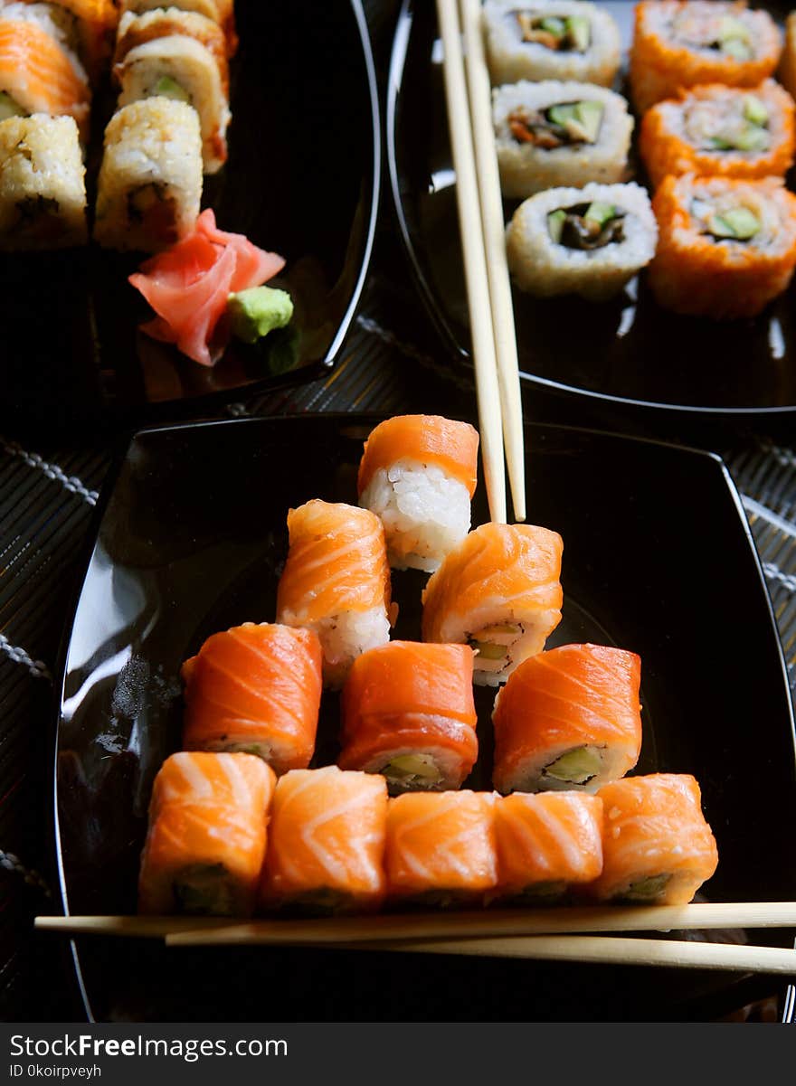 Japanese sushi on black plate, close up