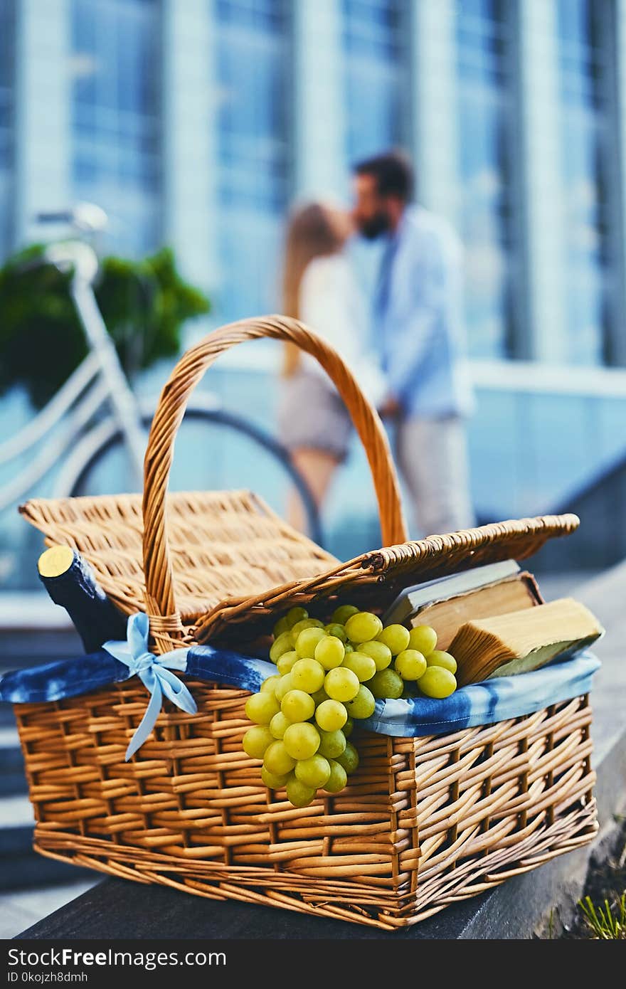 Close up image of picnic basket full of fruits, bread and wine. Close up image of picnic basket full of fruits, bread and wine.
