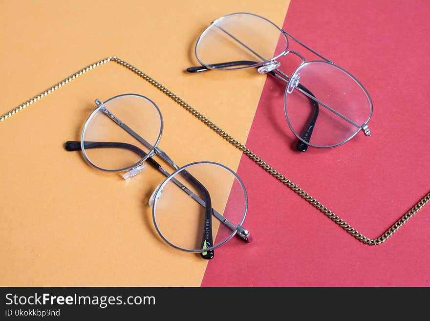 Two Clear Aviator Eyeglasses With Gray Steel Frame