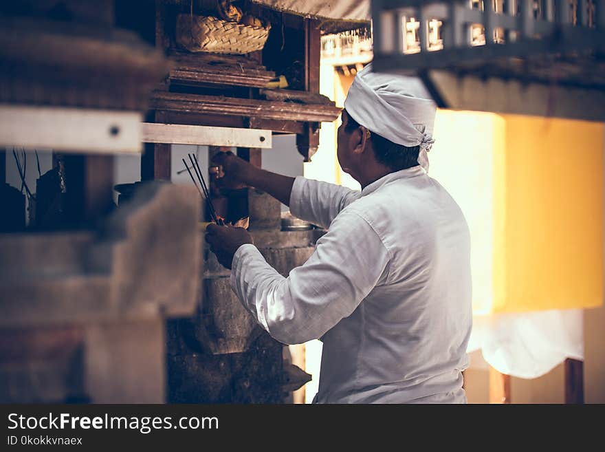 Photography of Man on Kitchen Room