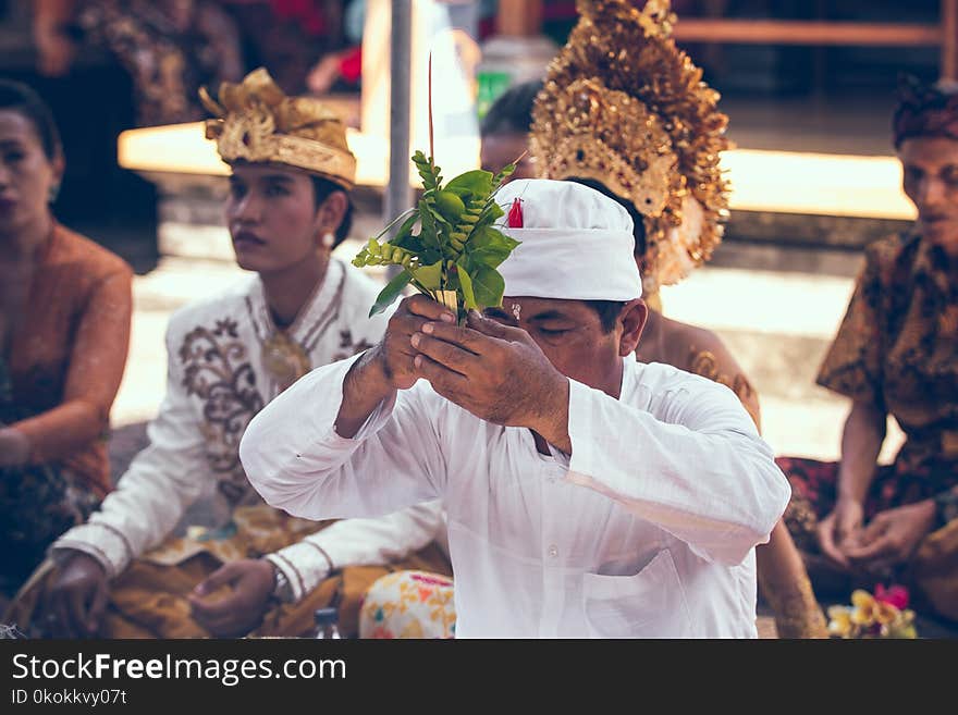 Man Holding Leaves