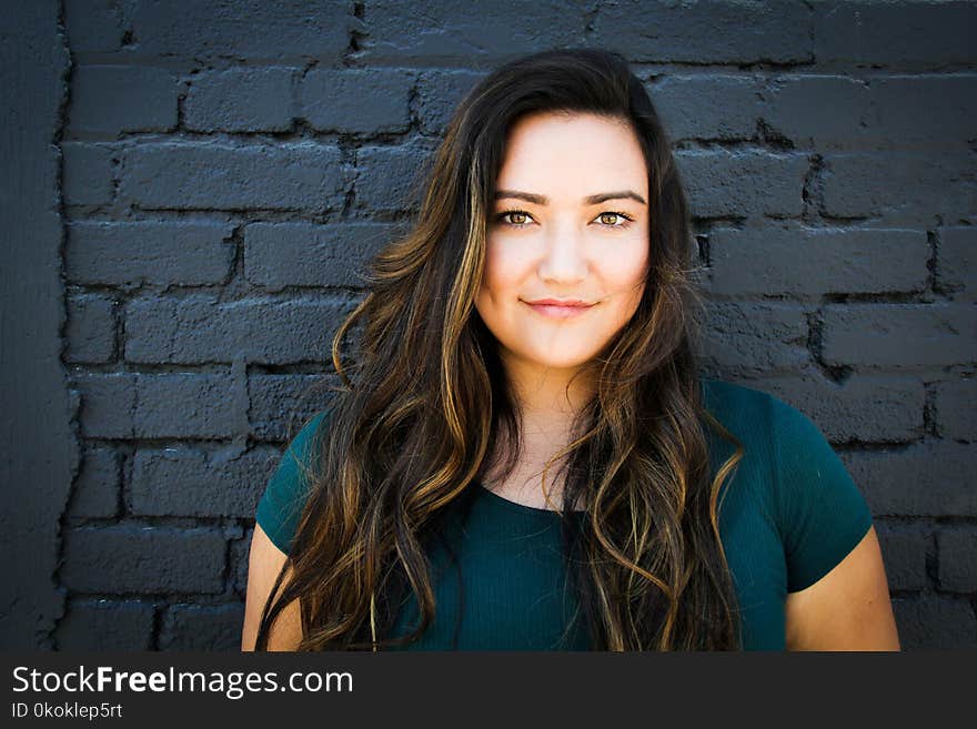 Close-Up Photography of a Woman Near Wall