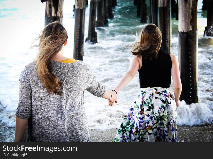 Photography of Women On Seashore