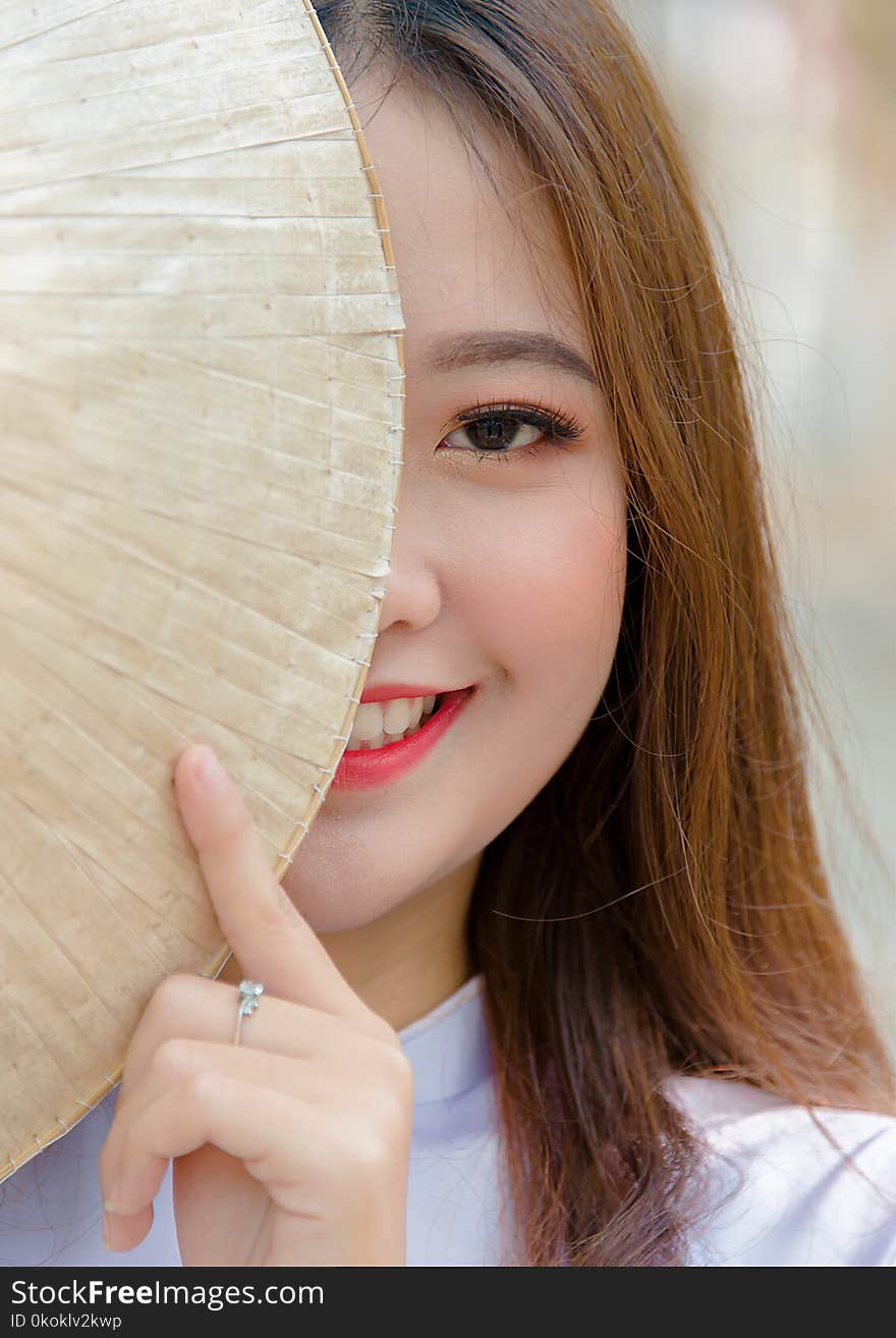 Photo Woman Hiding on Asian Conical Hat