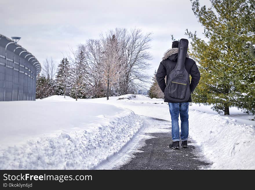 Man Walking On Pathway