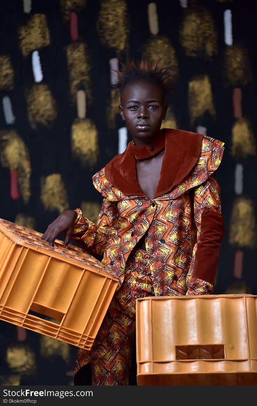 Woman Carrying Two Plastic Crates