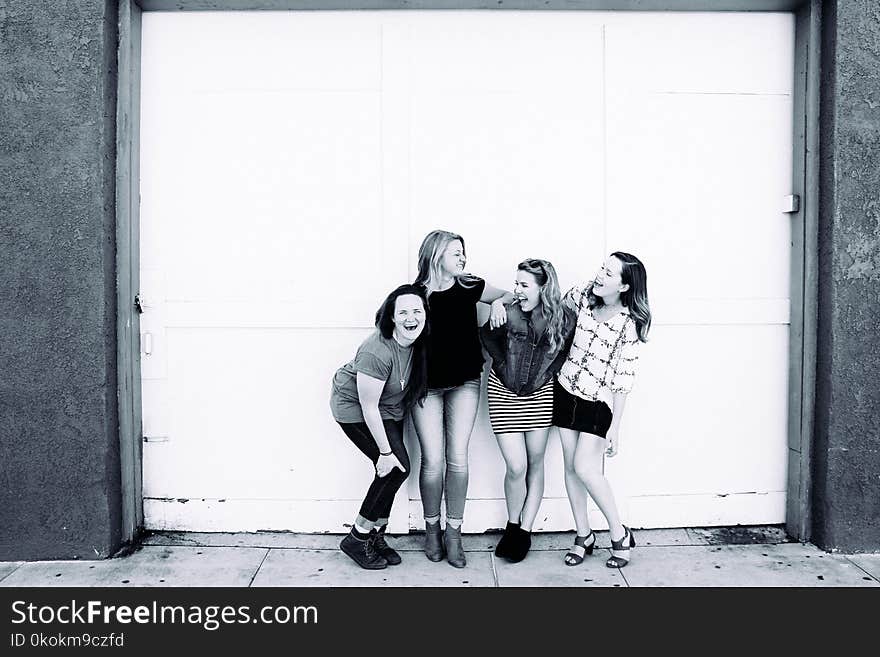 Grayscale Photography of Four Women Wearing Clothes