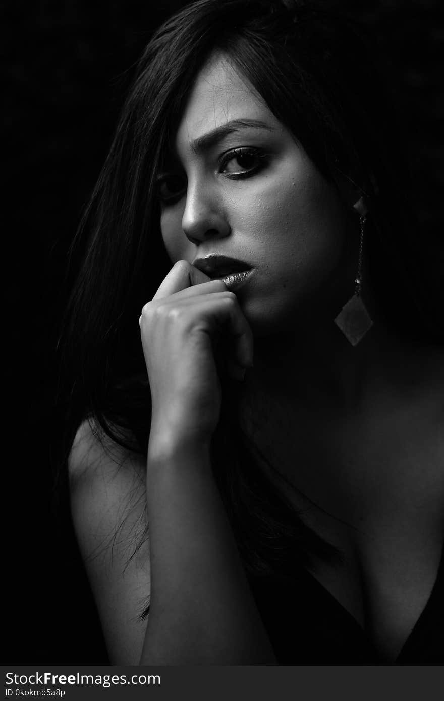 Grayscale Photo of Woman in Black Plunging Neckline Top