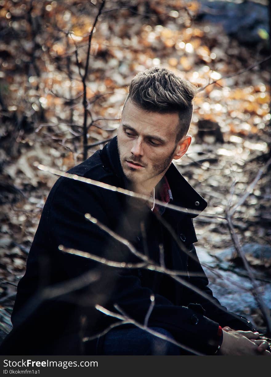 Close-Up Photography of a Man Wearing Black Coat