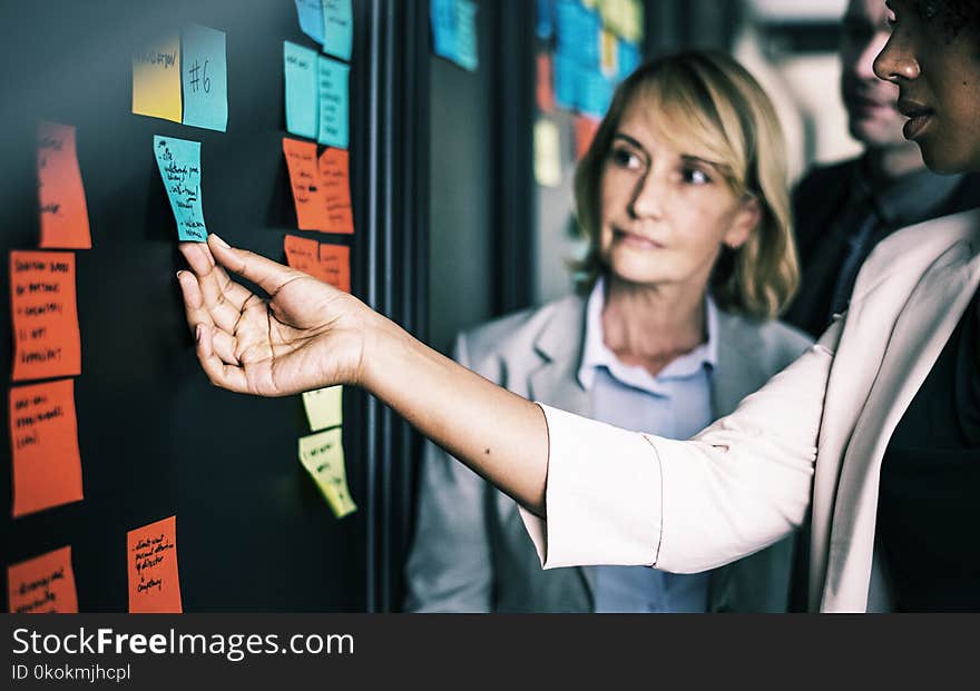 Woman Holding Sticky Note