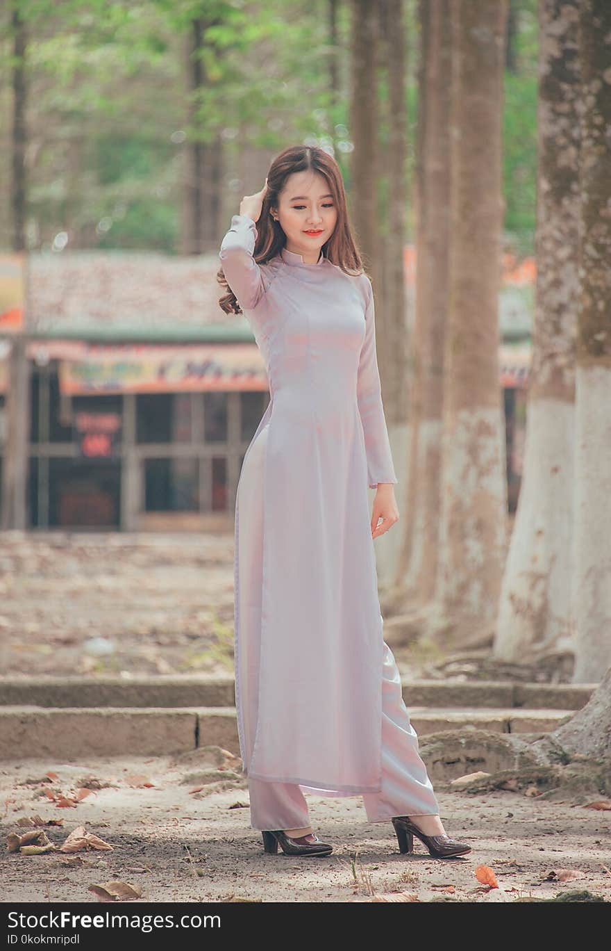 Photo of Woman Wearing Long Dress