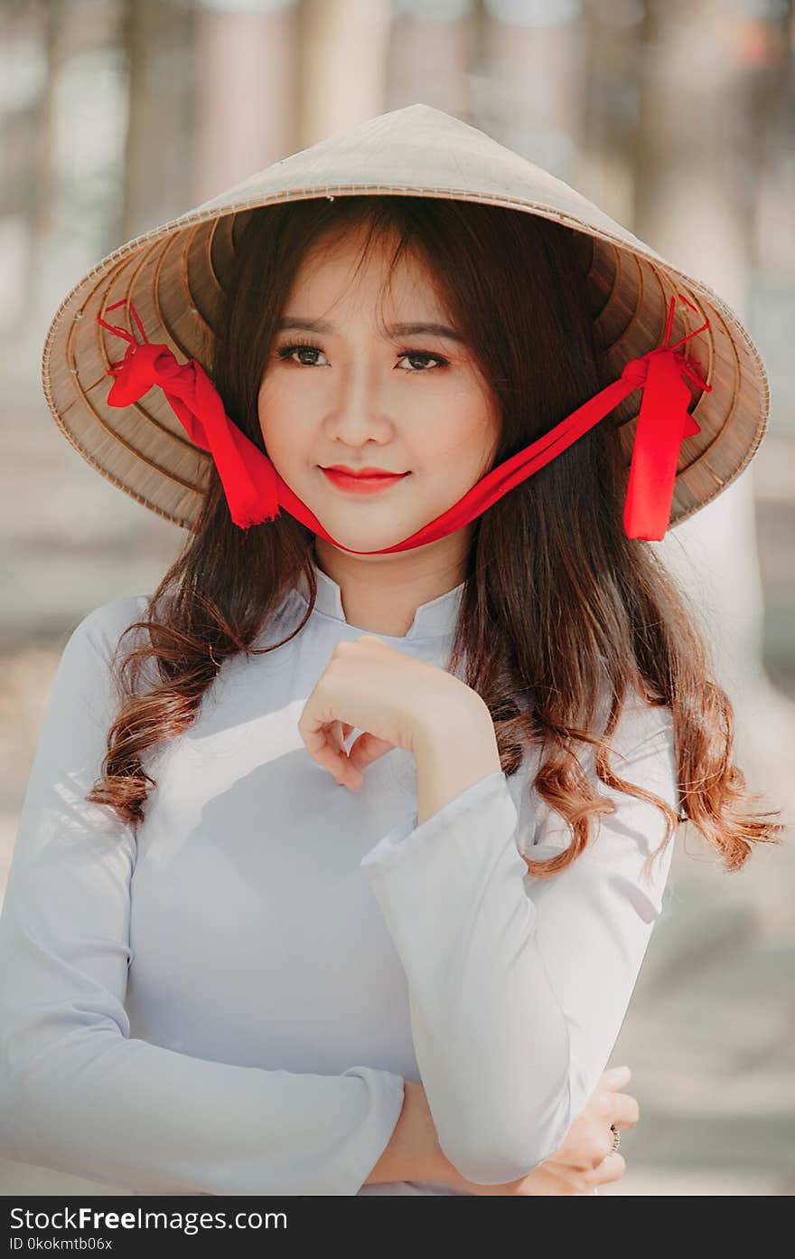 Photography of a Woman Wearing Asian conical hat