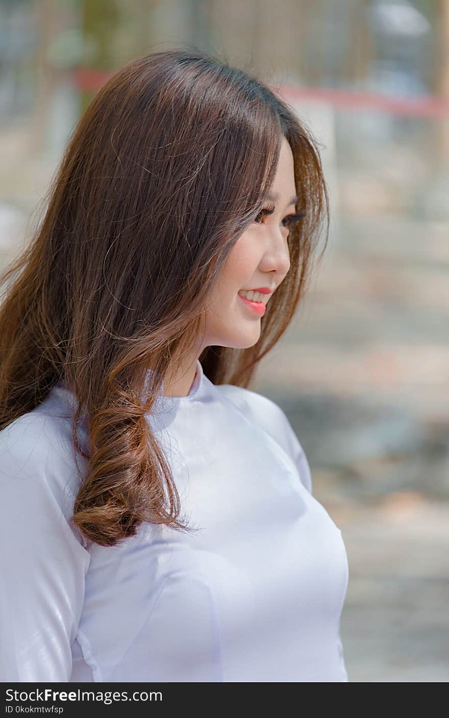 Side View Photo of Woman Wearing White top