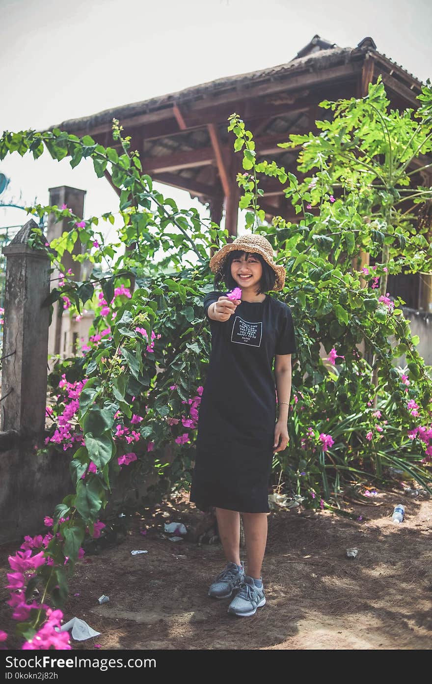 Photo of Woman Holding Flower