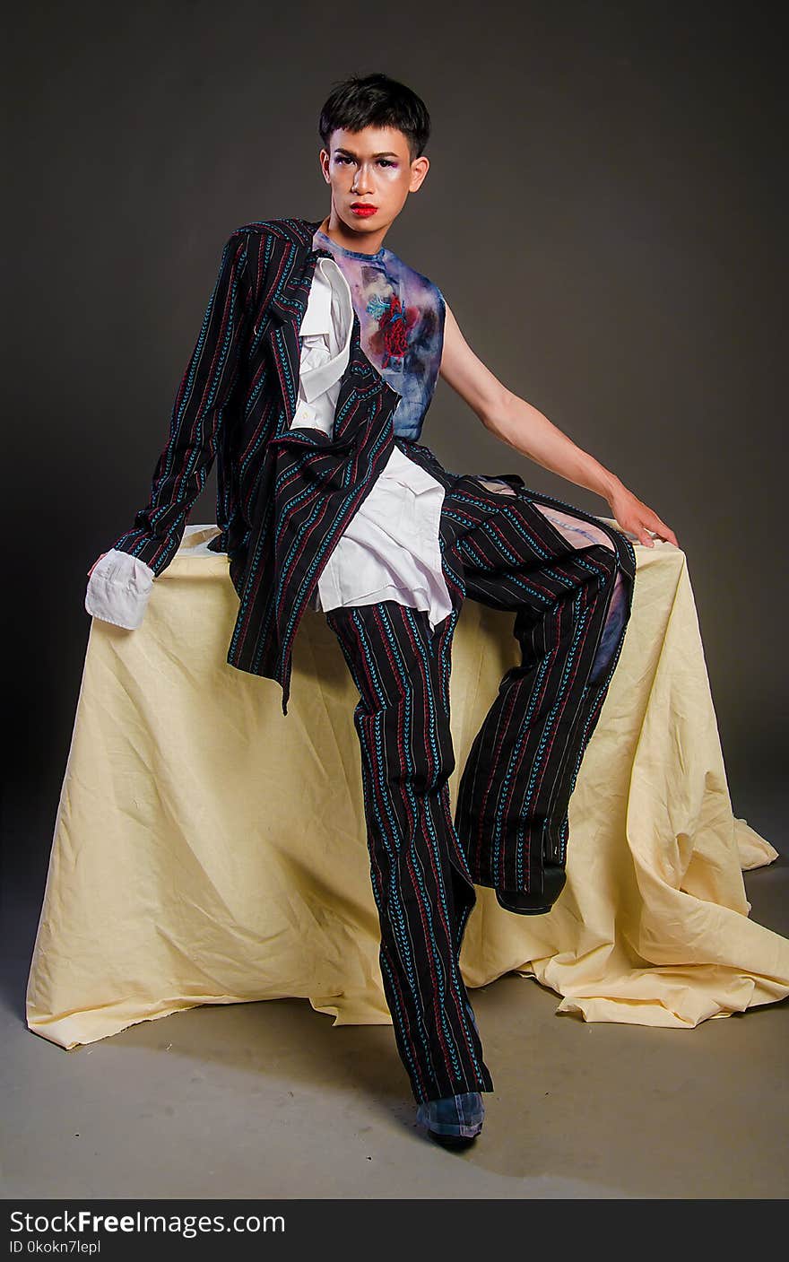 Photography Of Man Wearing Multi-colored Pinstripe Outfit