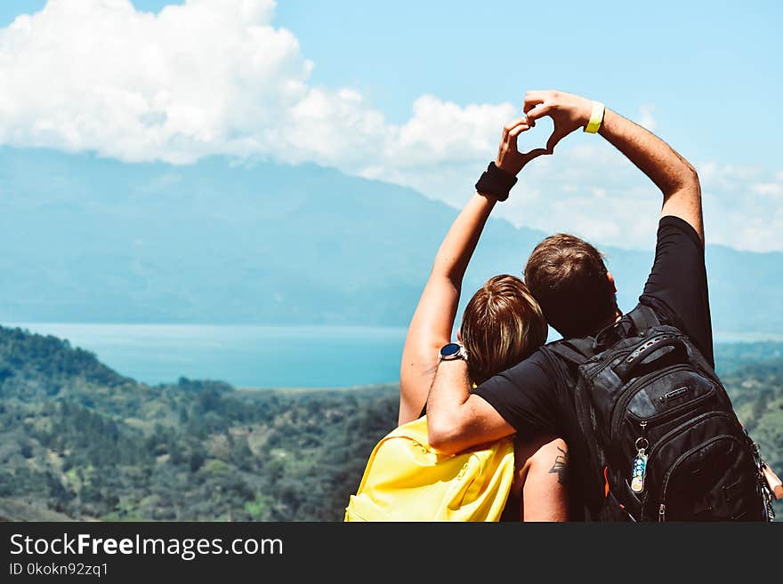 Man And Woman Forming Heart Hand Shape