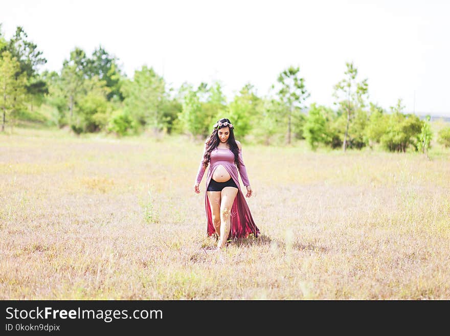 Maternity Photo Shoot of Woman Wearing Slit Front Dress