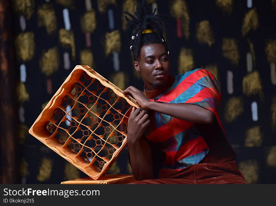 Photo of Man Holding Plastic Bottle Crate