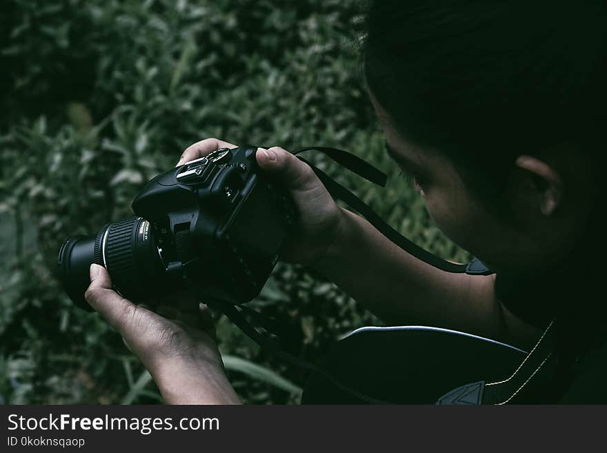 Person Holding Black Dslr Camera