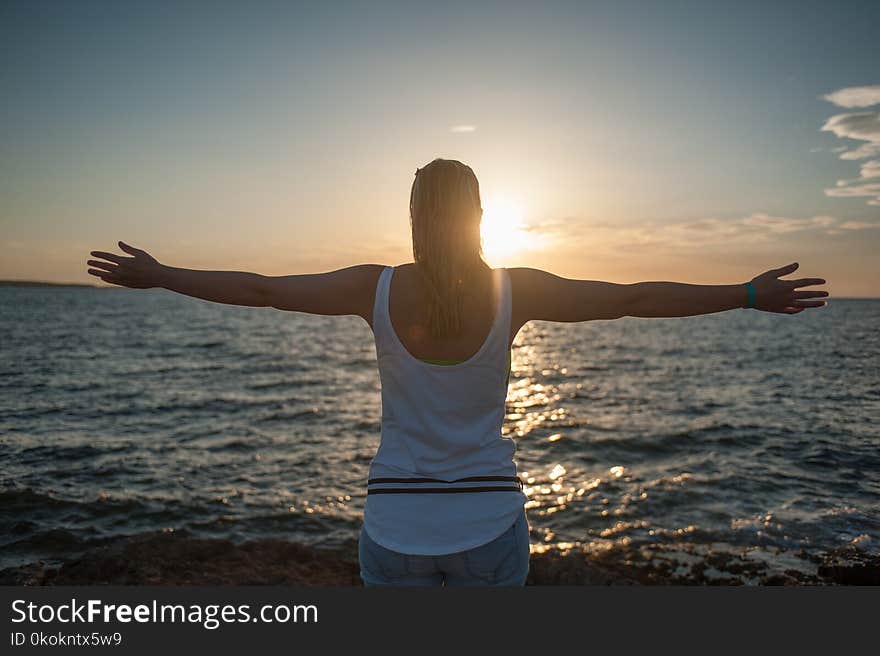 Photo of Woman Near Ocean