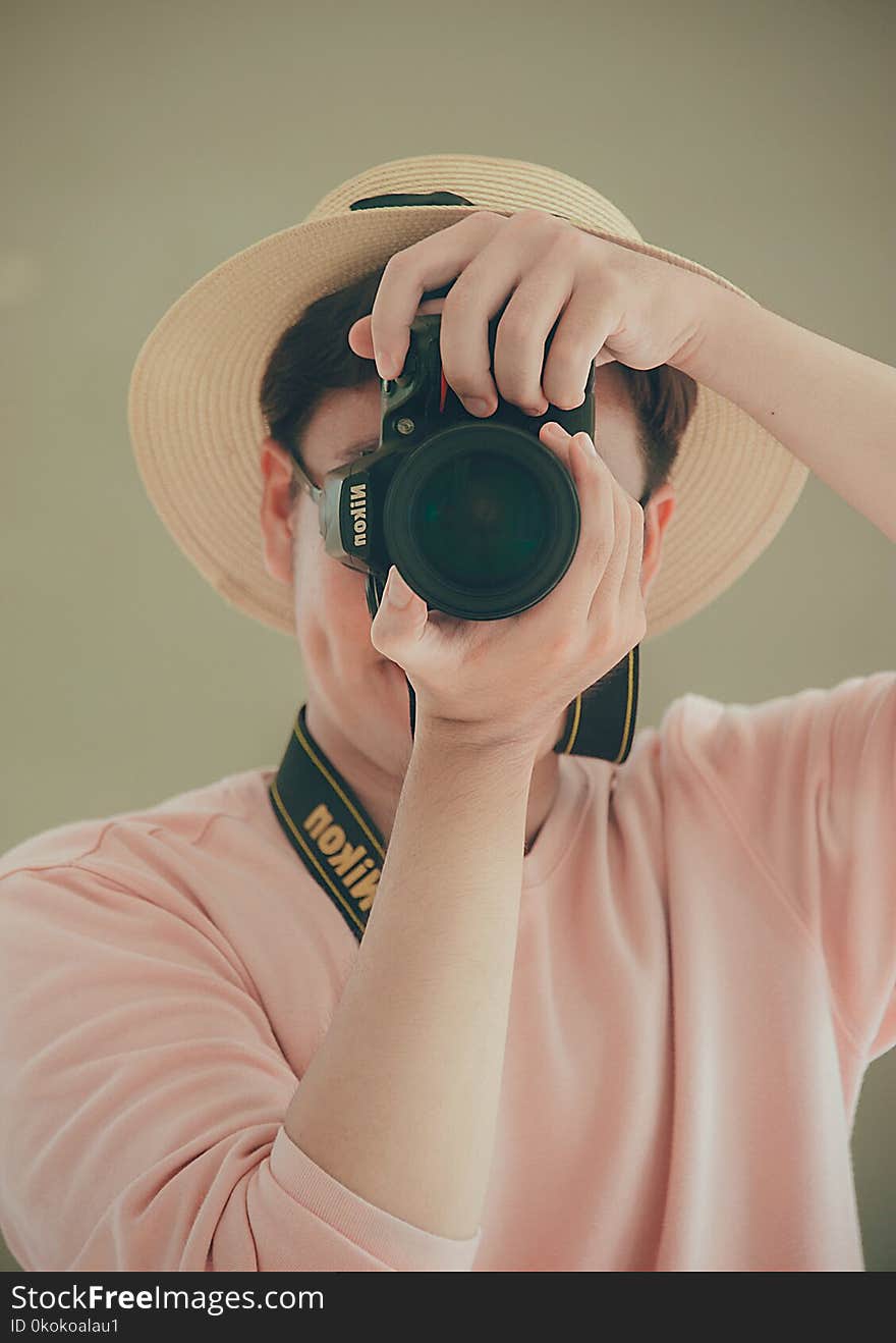 Man Holding Nikon Dslr Camera