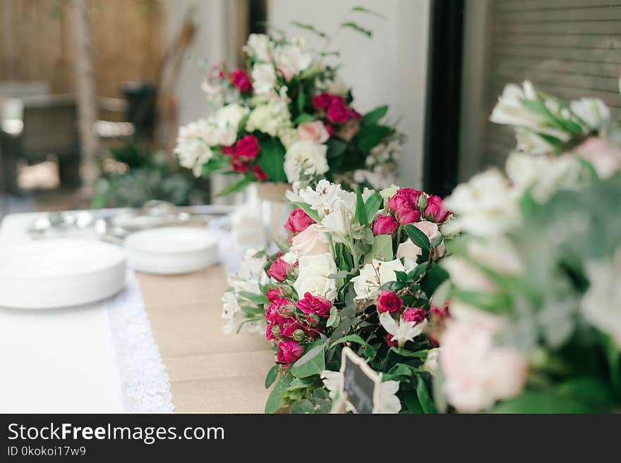 White and Pink Flower Bouquet on White Table