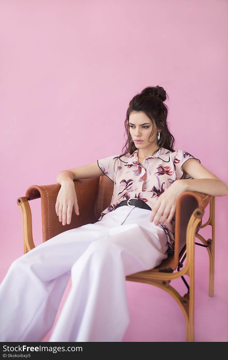 Photography of a Woman Sitting on Chair