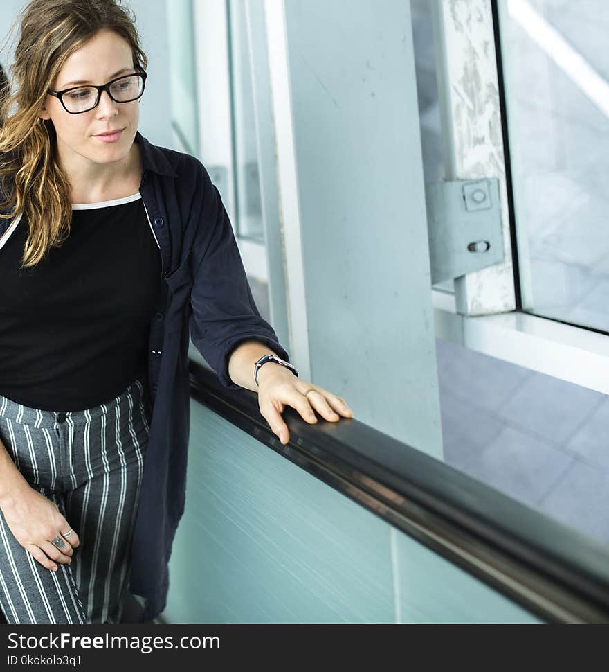 Woman in Black Cardigan Wearing Eyeglasses